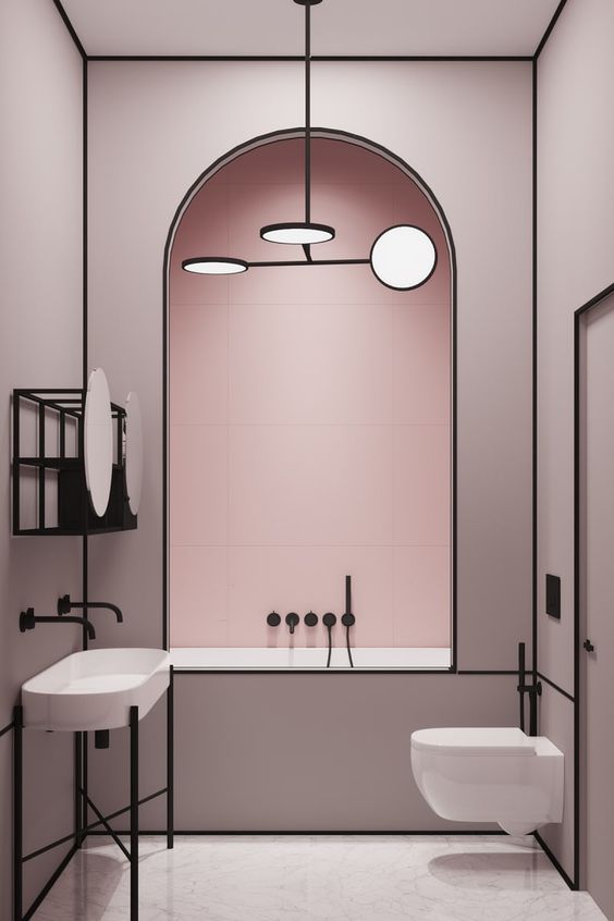 a chic modern light pink bathroom accented with matte black edges and lines looks very elegant and very bold