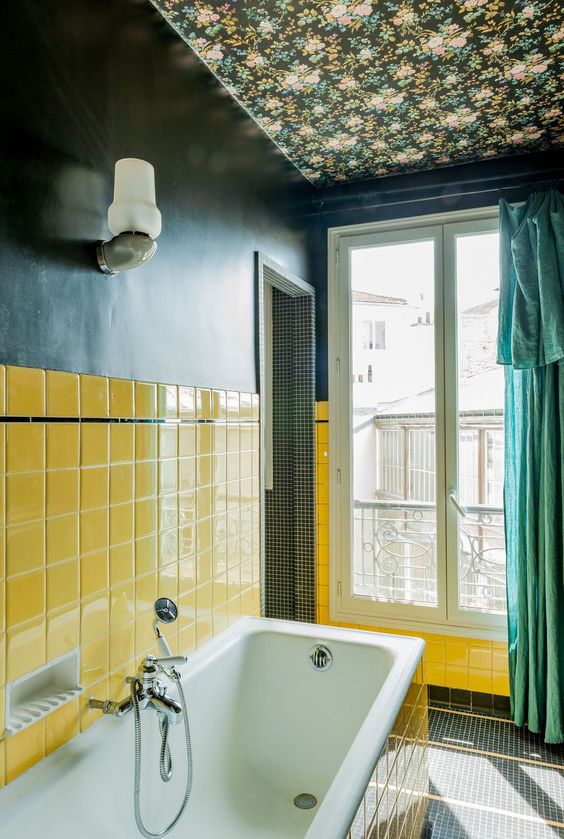 a colorful bathroom made more refined and whimsy with moody floral wallpaper on the ceiling