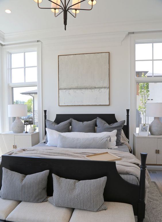 a vintage bed can be made bolder and cooler with just some coats of black paint