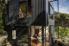 01 This contemporary house is built in New Zealand and features a tower-like design that arises among the trees