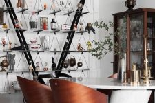 04 The dining room shows off curved chairs, a marble table and an open storage unit