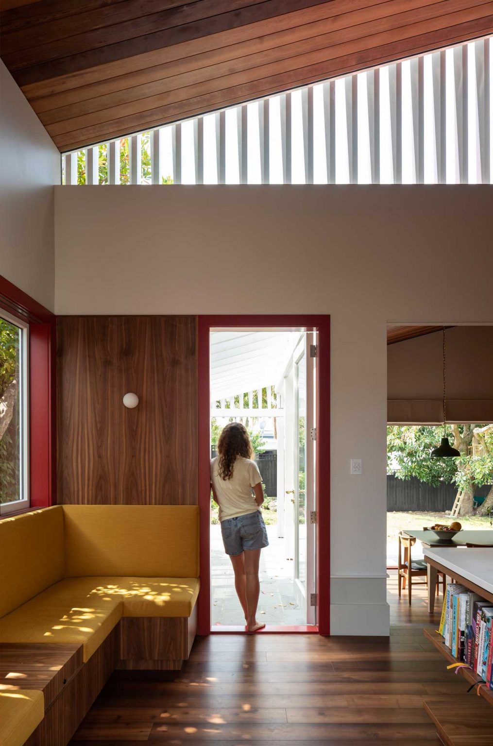 The doors and windows show off red frames that burst the spaces with color and look extra bold