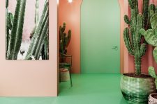 05 The entryway is also pink and green, with a lot of cacti and some simple furniture