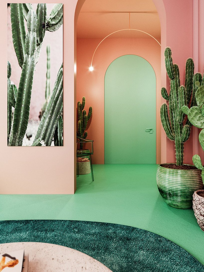 The entryway is also pink and green, with a lot of cacti and some simple furniture