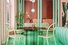 06 The dining space shows off a green glass table and green chairs plus pendant lamps