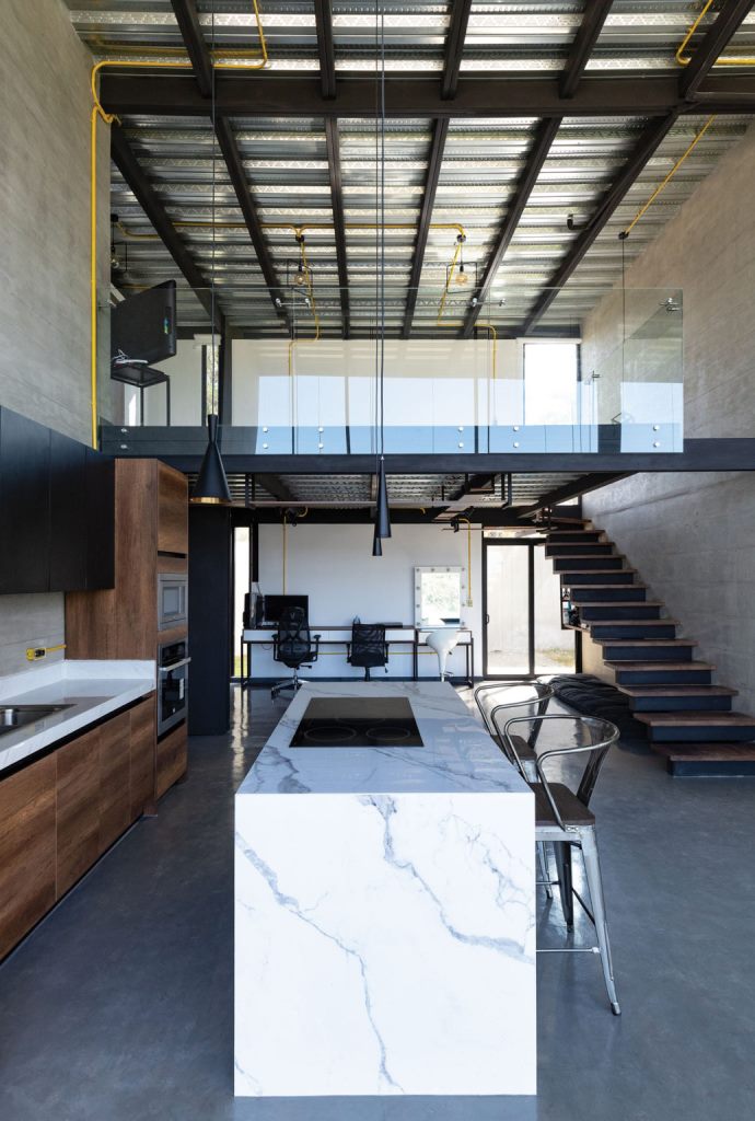 The kitchen island is also used for eating here, and there's a double work space at the end of this room The kitchen island is also used for eating here, and there's a double work space at the end of this room