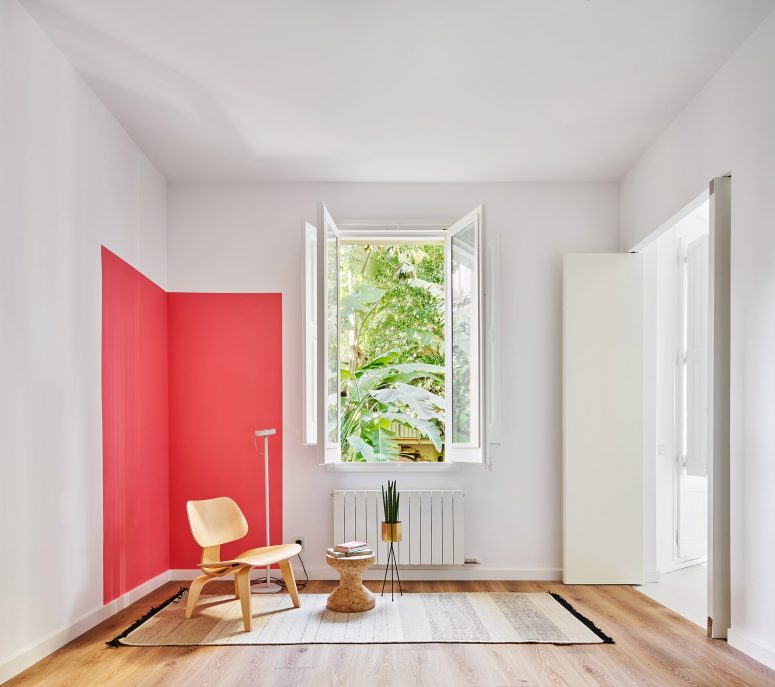 This space is accented with a bright red square that adds interest to the space easily