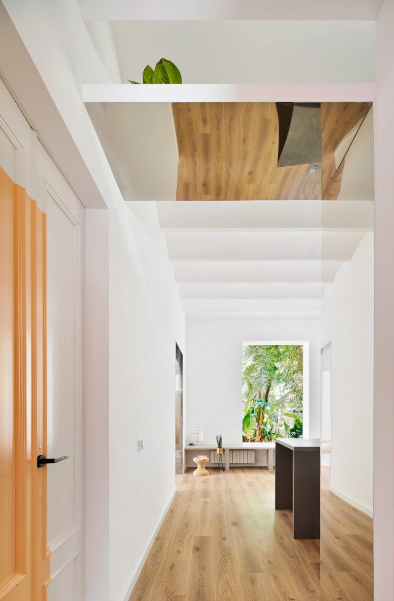 The apartment feels spacious, airy and bright thanks to large windows in each room