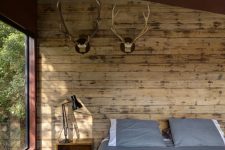 bedroom with a wood statement wall