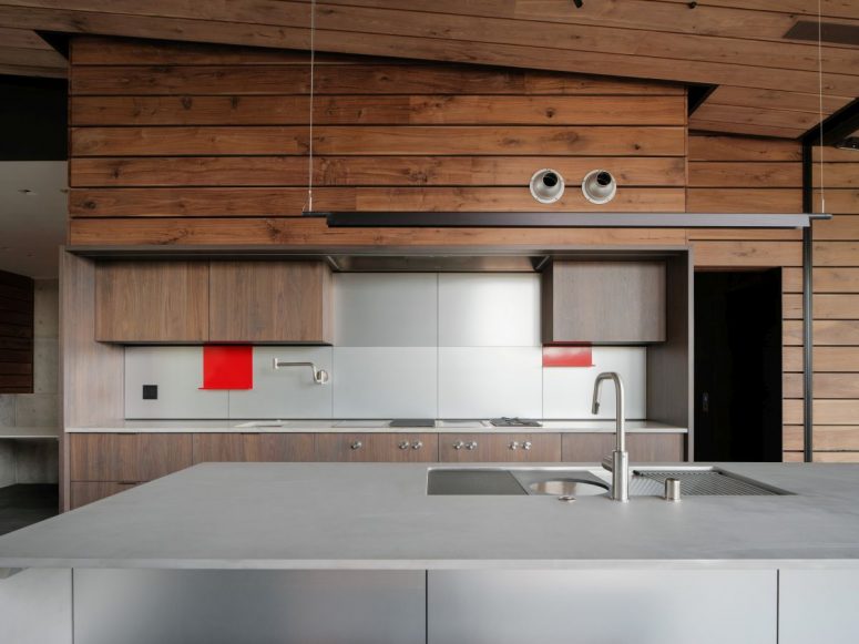 The kitchen has a large island and features wooden accents for added warmth and style