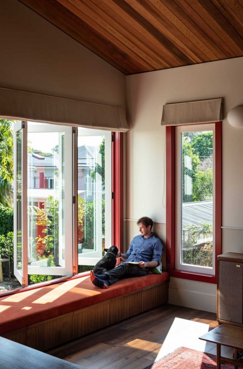 The window is done so that the owners can completely open this space to outdoors