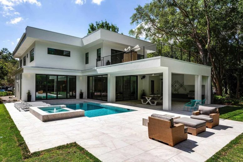 The outdoor space features a pool, a hot tub and a lounge space, too