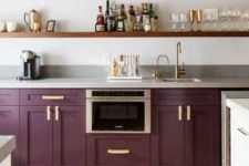 a purple kitchen with only lower cabinets and open shelving instead of uppers is an elegant and chic space