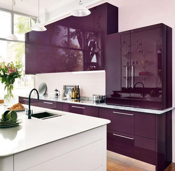 luxurious and glamourous kitchen idea with shiny purple ambiance glowing  silver toned backsplash black painted…