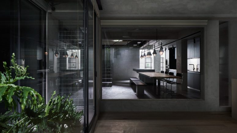This apartment in Taiwan was renovated in a moody grey color palette, and the basement space was refreshed to make it functional