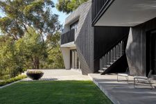 02 The house is clad with black cypress, concrete and blackened steel to give it an ultimate look