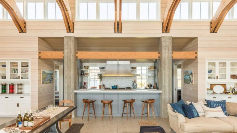 The kitchen is sunken between living and dining rooms, there's an additional meal space at the kitchen island