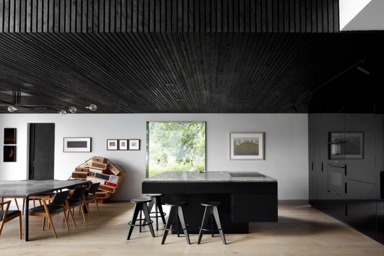 The exterior of the house is continued indoors to make the spaces cohesive