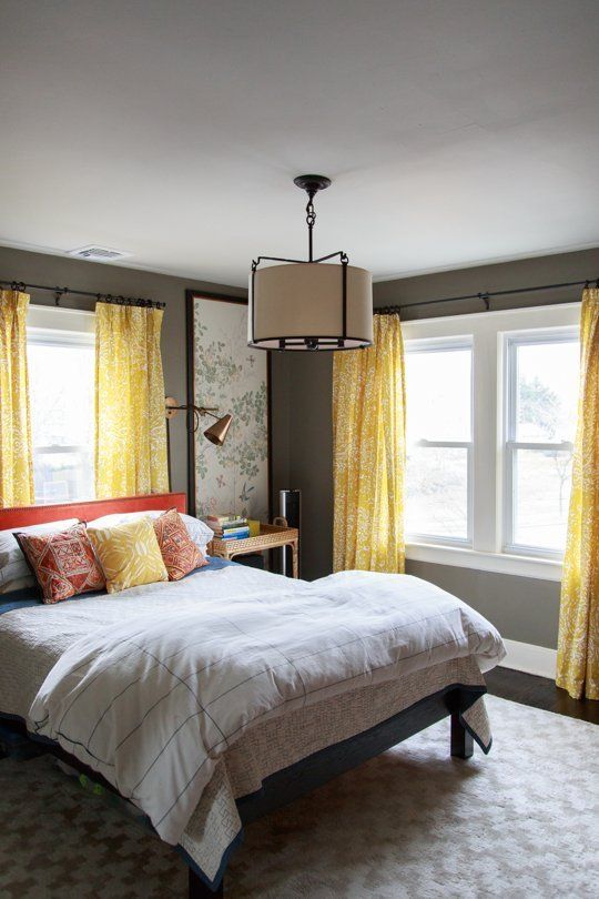 a stylish bedroom design in grey and yellow colors