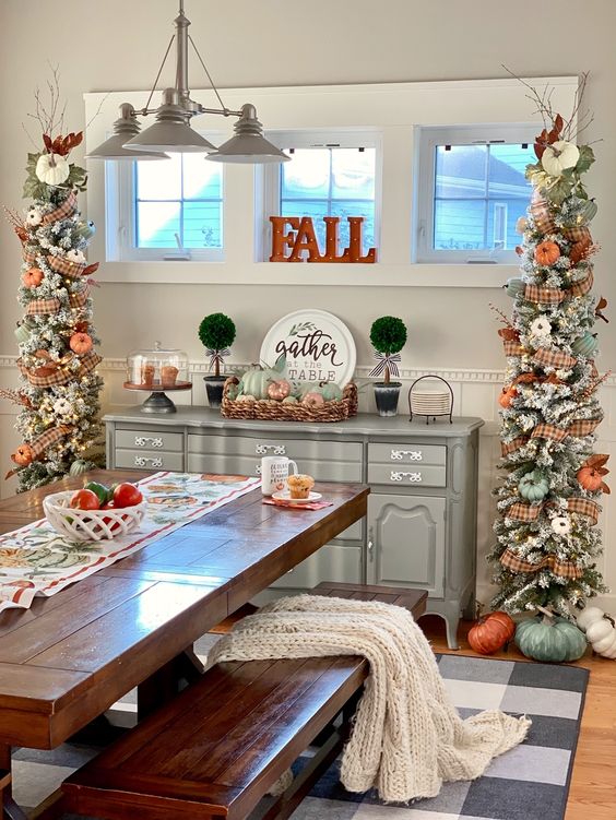 two pretty rustic Thanksgiving trees with lights, plaid ribbons, orange and green pumpkins and branches