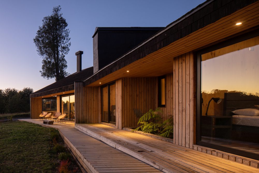 The bedrooms are placed in a line and are extended outside via a semi covered wooden deck