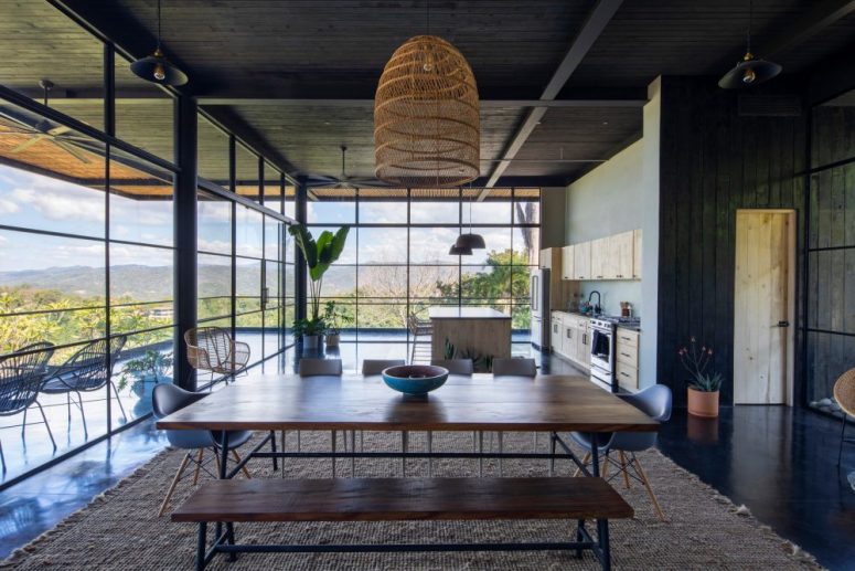 The kitchen and dining space are on the ground floor and can be opened to a large terrace, if not, they still get much natural light through glass walls