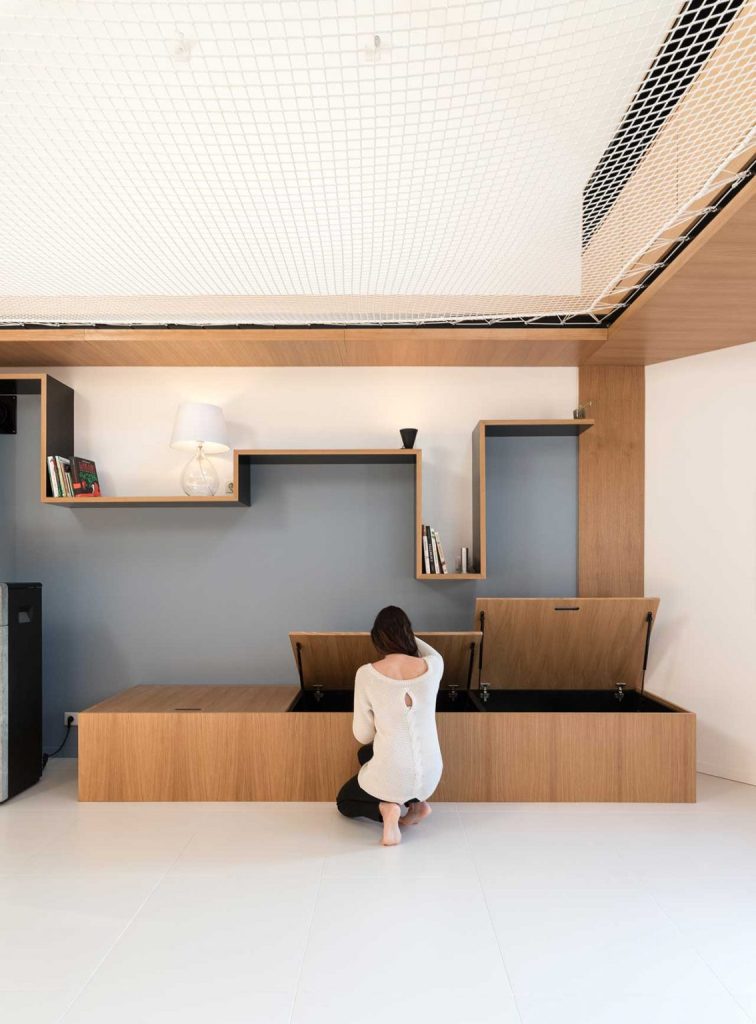 This bench or daybed features much storage inside, a creative shelf over it gives some space for storage, too This bench or daybed features much storage inside, a creative shelf over it gives some space for storage, too