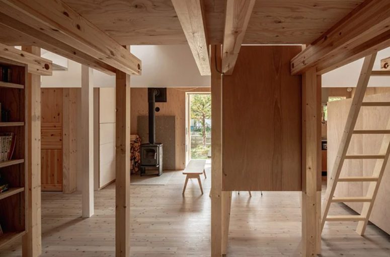 A cozy hearth brings warmth to the spaces and firewood adds a natural and cozy touch