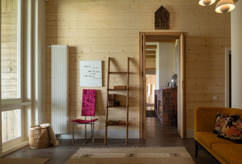 Much light colored wood was used in decor, and modern furniture is paired with wooden and woven items Much light-colored wood was used in decor, and modern furniture is paired with wooden and woven items