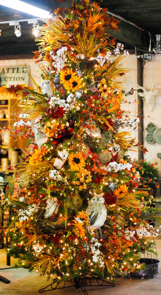 a bright fall to Thanksgiving tree with lights, cotton, faux blooms, greenery and branches plus pinecones is wow