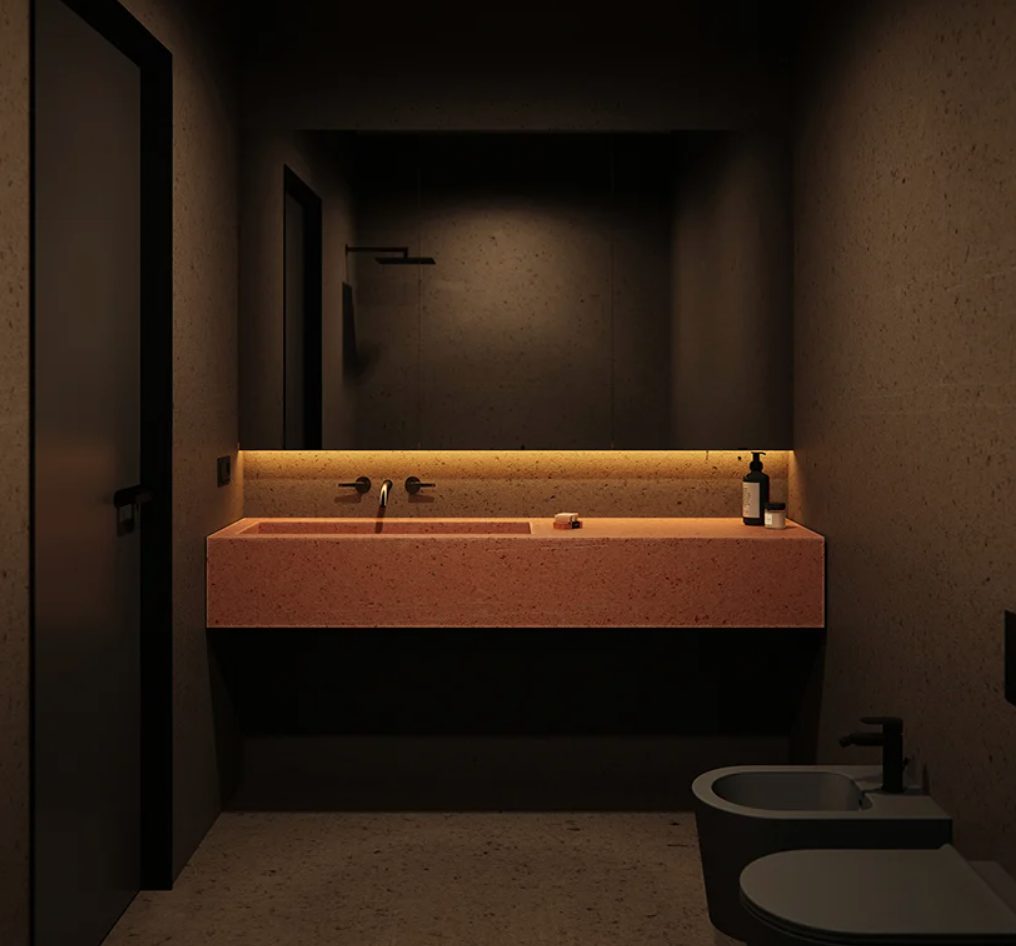 The bathroom is done in black, with a red pigment cement vanity and sink