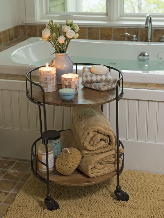 a rustic rolling cart of blackened steel and wooden tiers is a stylish idea for a rustic or vintage space