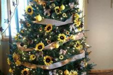 14 a fall tree decorated with faux sunflowers, lights, ribbon bows, burlap bows and bright yellow ornaments