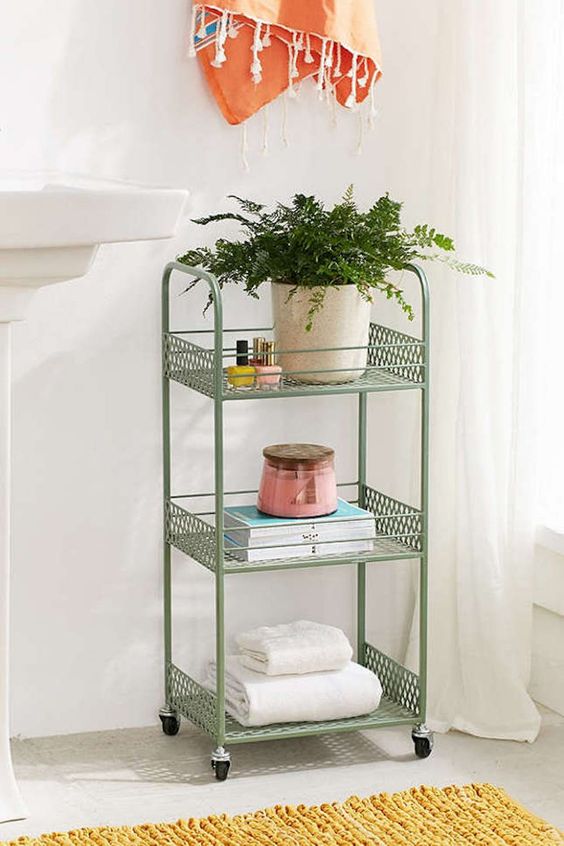 a vintage green rolling cart is a nice splash of color and a chic item for a cool look