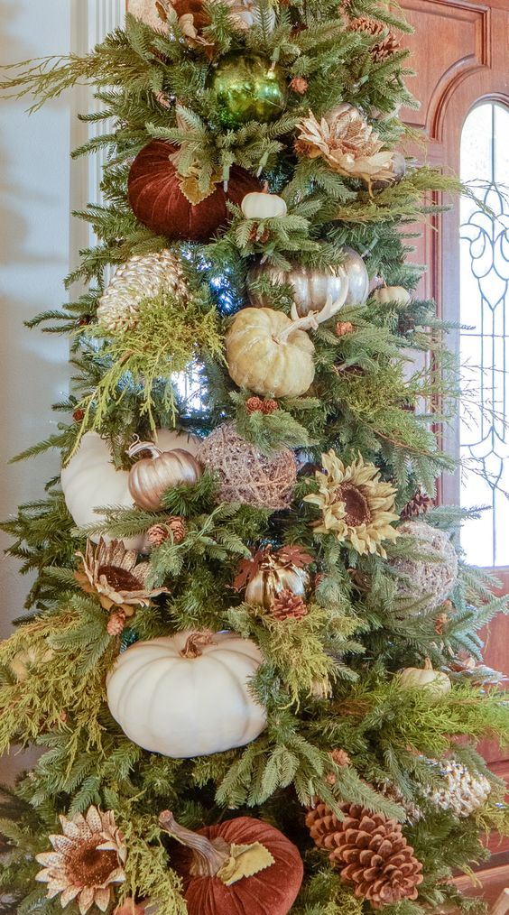 a gorgeous fall or Thanksgiving tree with large faux and velvet pumpkins, blooms, lights and metallic yarn balls