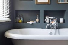 17 built-in box-shaped shelves over the tub can hold everything you may need and won’t take any floor space