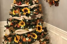 19 a stylish rustic Thanksgiving tree with burlap ribbons, lights, faux pumpkins and blooms, a matching wreath