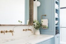 24 a powder blue vanity paired up with a tall storage unit with closed and open storage compartments