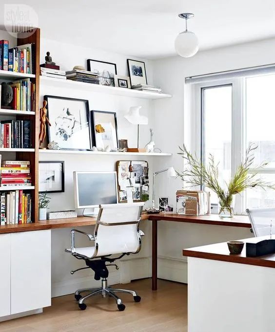 a stylish modern home office with an L-shaped desk, a white chair, open shelves and bookshelves is a comfortable working space