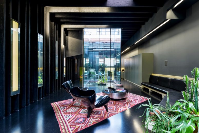This bold contemporary house is called Lost House and features black interiors with much chic
