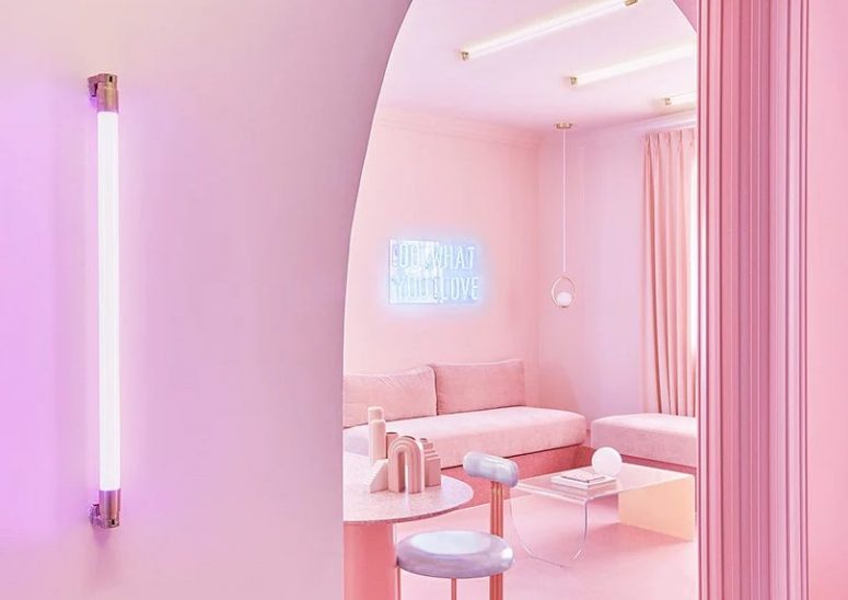 a neon lamps and signs is a nice addition to a surreal interior The apartment looks beautiful, with many soft and candy shades of blush and pink, with neon lamps and signs