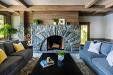 a cozy stone fireplace makes a statement in this living room