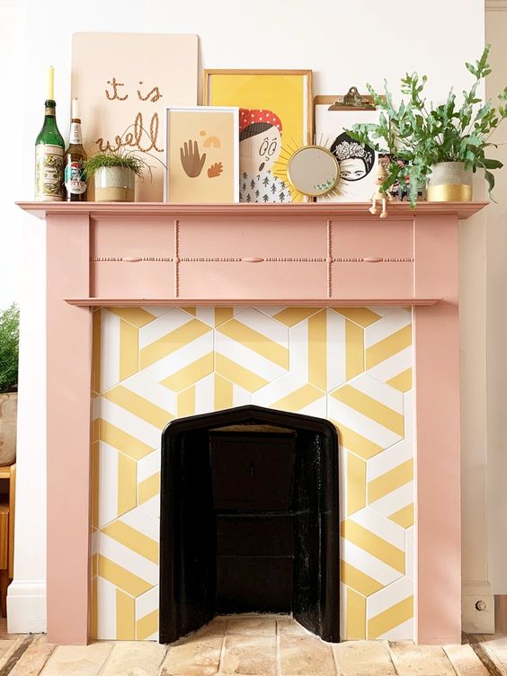 a cheerful fireplace with hex striped tiles around and a pink mantel plus quirky art looks very unusual and whimsical