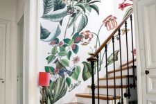 04 a refined entryway with a beautiful realistic floral accent wall over the staircase looks very chic and sophisticated