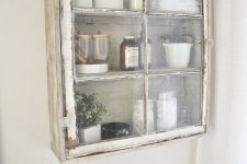 a shabby chic cabinet is a nice addition to a bathroom’s decor