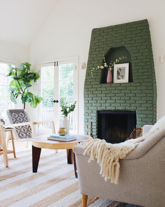 - تصآميم مدفأة ملونة انيقة .. ! 09-a-fireplace-with-a-green-brick-surround-brings-color-to-this-neutral-space-and-makes-it-catchier-and-more-interesting