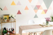 10 a colorful geometric accent wall done with bright triangles is a creative idea for a modern dining room