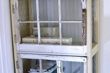 10 a shabby chic glass cabinet with old window frames instead of doors is a cool idea for a vintage bathroom