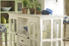 11 a shabby chic kitchen island made of a cabinet with window frames as glass doors and drawers is a stylish idea