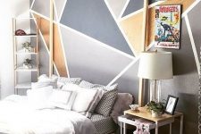 12 a modern bedroom with a geometric print accent wall, simple furniture and bold posters is a bold idea